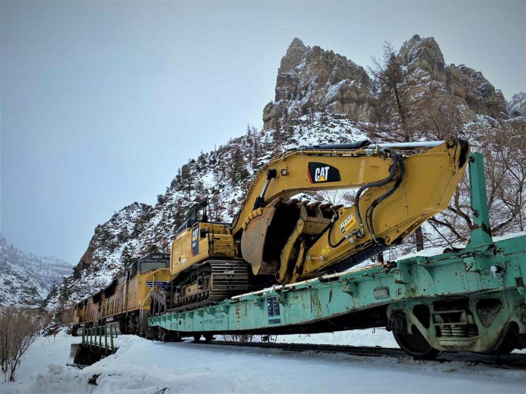 Transporting Excavator by rail to repair I-70