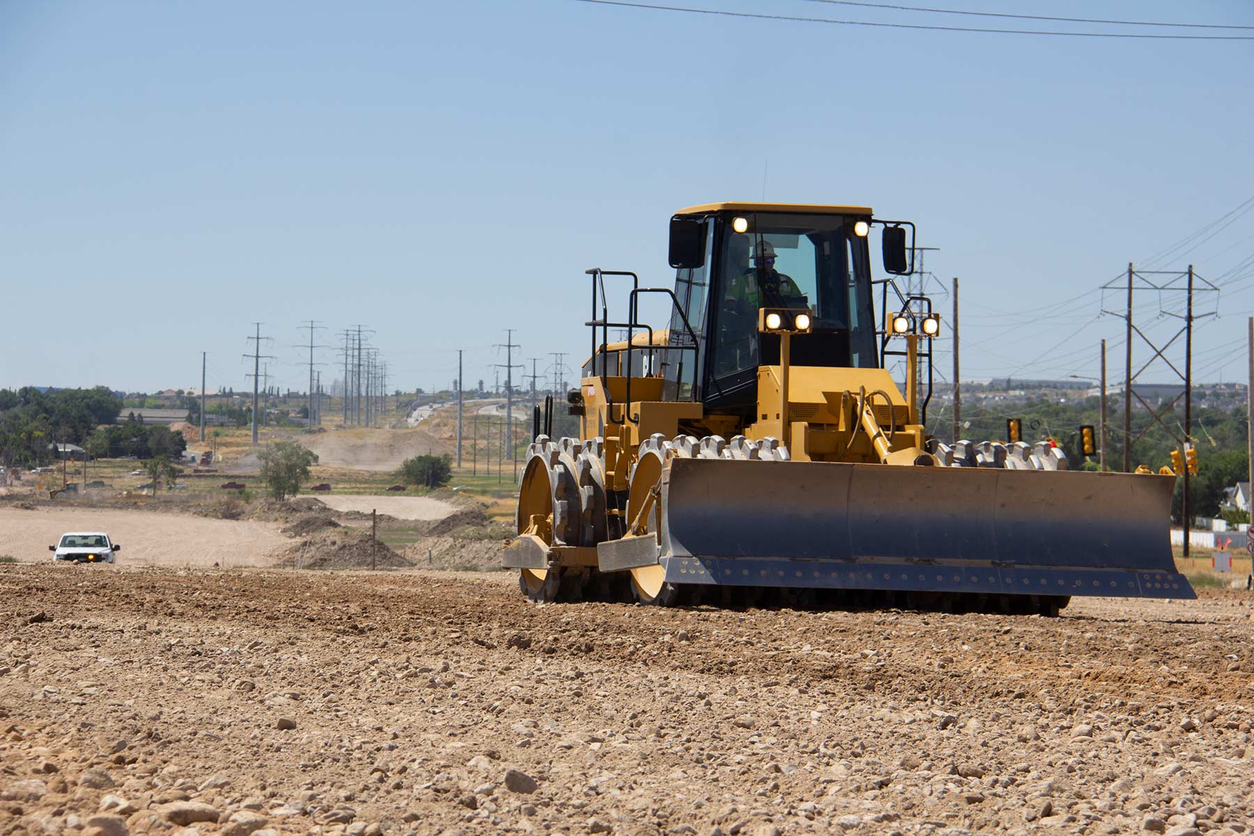Compacting new material on Mountain View Corridor